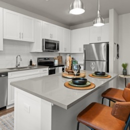 a kitchen with white cabinets