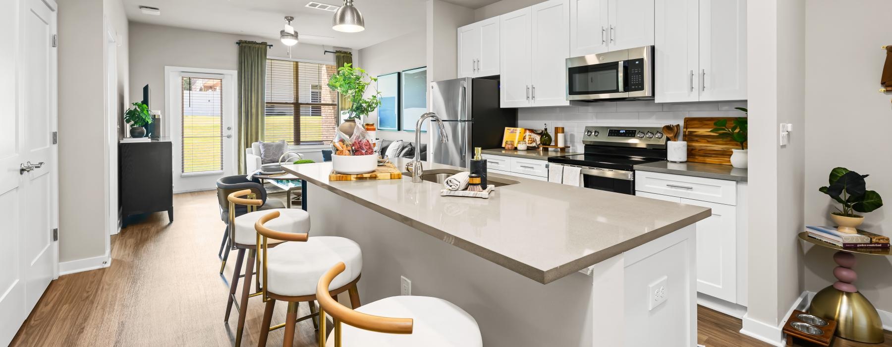 a kitchen with white cabinets