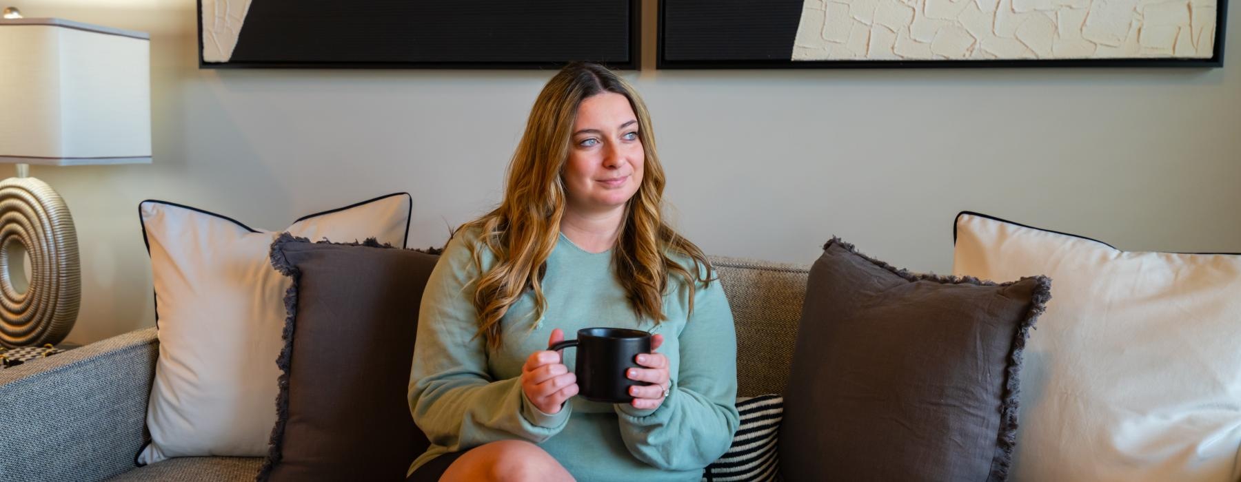a woman sitting on a couch