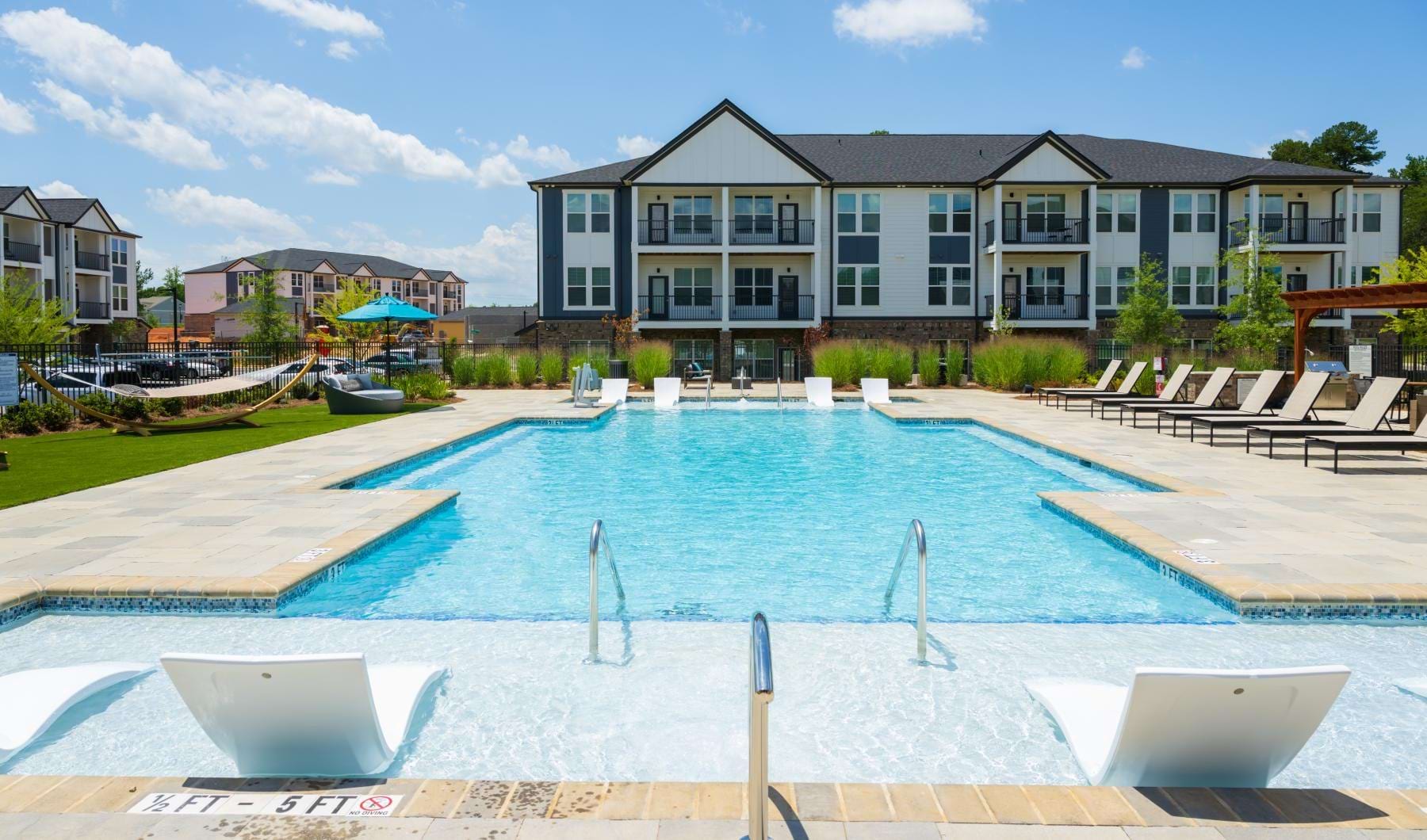 a swimming pool with in-water seating