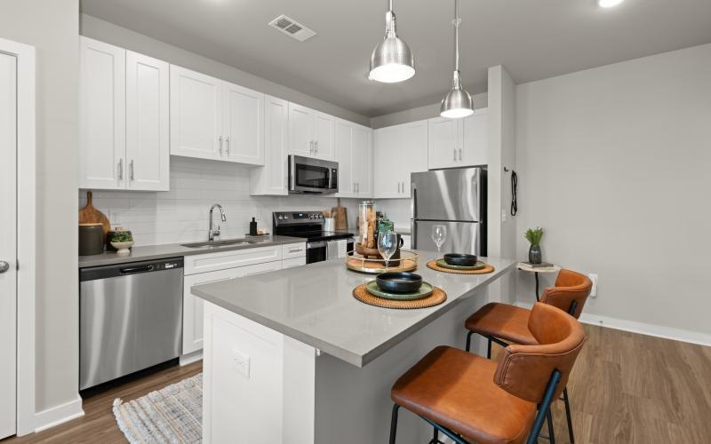 a kitchen with white cabinets